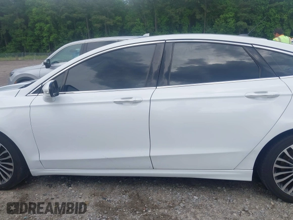 2017 Ford Fusion Titanium z VIN 3FA6P0K93HR203063, wystawiony jako IAAI lot #42243064 z przebiegiem 176 078 mil mil oraz . Historia ofert i sprzedaży dostępna na DreamBid. Obrazek 15.