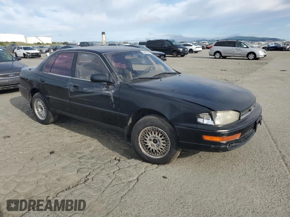 1993 Toyota Camry LE with VIN JT2SK12E4P0112014, listed as a Copart auction lot 52822095 with 249,458 mi miles and Salvage Title. Bid and sale history available at carsss.com. Image 4.