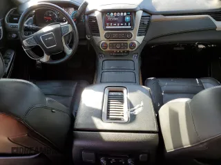 2018 GMC Yukon Denali with VIN 1GKS2CKJ3JR404177, listed as a Copart auction lot 82577354 with 129,744 mi miles and Salvage Title. Bid and sale history available at carsss.com. Image 8.