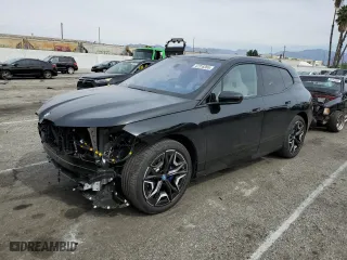 2025 BMW iX xDrive50 with VIN WB523CF06SCT06612, listed as a Copart auction lot 47318365 with 2,297 mi miles and Salvage Title. Bid and sale history available at carsss.com. Image 1.