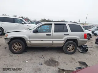 2004 Jeep Grand Cherokee Laredo with VIN 1J4GX48S44C301120, listed as a IAAI auction lot 41281556 with 267,246 mi miles. Bid and sale history available at carsss.com. Image 15.