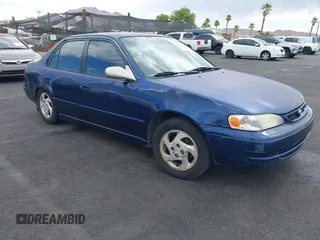 1998 Toyota Corolla VE z VIN 1NXBR18E1WZ076392, wystawiony jako IAAI lot #42604757 z przebiegiem 109 429 mil mil oraz . Historia ofert i sprzedaży dostępna na DreamBid. Obrazek 1.