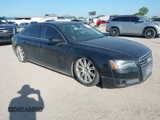 2011 Audi A8 with VIN WAUAVAFD6BN000996, listed as a IAAI auction lot 42828404 with 153,628 mi miles and . Bid and sale history available at DreamBid. Image 1.