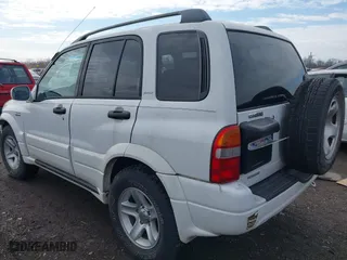 2001 Suzuki Grand Vitara JLX with VIN JS3TD62V114157738, listed as a IAAI auction lot 41721813 with 134,661 mi miles. Bid and sale history available at carsss.com. Image 3.