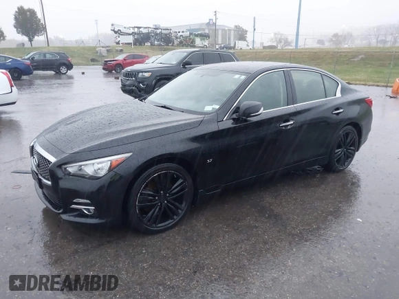 2015 Infiniti Q50 Premium z VIN JN1BV7ARXFM412382, wystawiony jako IAAI lot #40776813 z przebiegiem 66 406 mil mil oraz . Historia ofert i sprzedaży dostępna na DreamBid. Obrazek 2.
