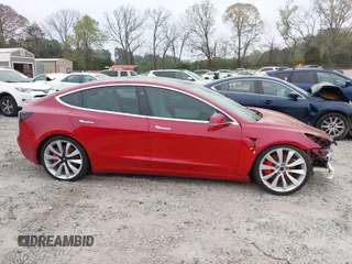 2018 Tesla Model 3 Long Range Battery with VIN 5YJ3E1EB7JF055384, listed as a IAAI auction lot 41924325 with 52,039 mi miles and . Bid and sale history available at DreamBid. Image 12.