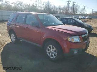2010 Mazda Tribute Touring with VIN 4F2CY9C77AKM04941, listed as a Copart auction lot 50802955 with 118,480 mi miles and Salvage Title. Bid and sale history available at carsss.com. Image 4.