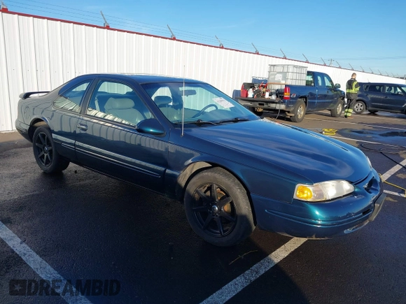 1996 Ford Thunderbird LX z VIN 1FALP62W1TH100925, wystawiony jako IAAI lot #41289811 z przebiegiem 84 056 mil mil oraz . Historia ofert i sprzedaży dostępna na DreamBid. Obrazek 1.