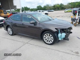 2019 Toyota Camry LE with VIN 4T1B11HKXKU818442, listed as a IAAI auction lot 41906128 with 30,728 mi miles and . Bid and sale history available at DreamBid. Image 1.