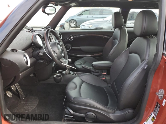 2013 MINI Hardtop S with VIN WMWSV3C57DT477948, listed as a Copart auction lot 54437155 with 63,114 mi miles and Salvage Title. Bid and sale history available at DreamBid. Image 7.