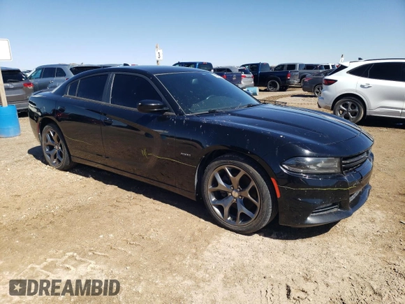 2015 Dodge Charger RT with VIN 2C3CDXCT0FH805909, listed as a Copart auction lot 42612035 with 77,493 mi miles and Salvage title. Bid and sale history available at DreamBid. Image 4.