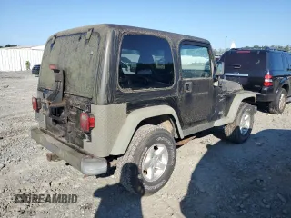 2001 Jeep Wrangler Sport with VIN 1J4FA49SX1P318889, listed as a Copart auction lot 67213064 with 157,444 mi miles and Clean Title. Bid and sale history available at carsss.com. Image 3.