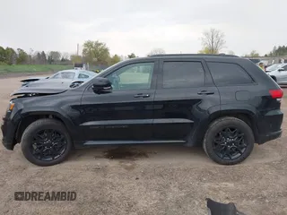 2021 Jeep Grand Cherokee 80th Anniversary with VIN 1C4RJFBG7MC828116, listed as a IAAI auction lot 42118355 with 57,240 mi miles and . Bid and sale history available at DreamBid. Image 15.