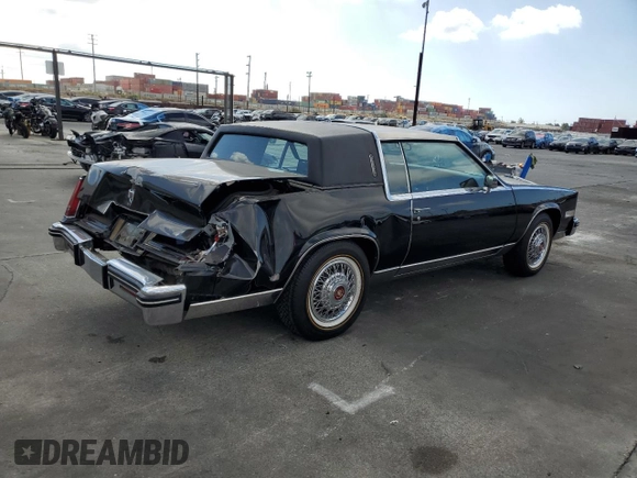 1985 Cadillac Eldorado z VIN 1G6EL578XFE640091, wystawiony jako Copart lot #71849374 z przebiegiem 30 631 mil mil oraz Szkody całkowita. Historia ofert i sprzedaży dostępna na DreamBid. Obrazek 3.