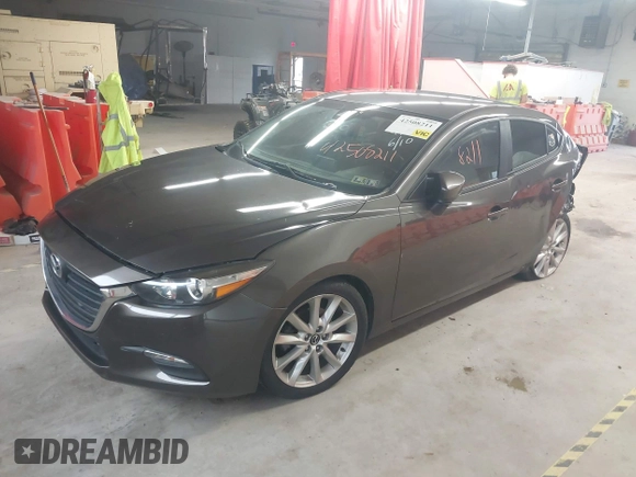 2017 Mazda 3 Touring z VIN JM1BN1V78H1142186, wystawiony jako IAAI lot #42508211 z przebiegiem 109 082 mil mil oraz . Historia ofert i sprzedaży dostępna na DreamBid. Obrazek 17.