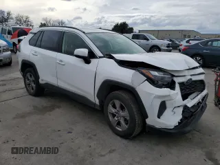 2023 Toyota RAV4 Hybrid LE with VIN JTMMWRFV3PD570648, listed as a Copart auction lot 86983174 with 27,258 mi miles and Salvage title. Bid and sale history available at DreamBid. Image 4.