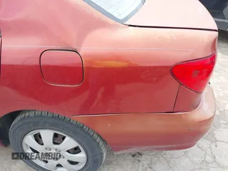 2004 Toyota Corolla CE with VIN 1NXBR32E14Z265397, listed as a IAAI auction lot 42182313 with 200,035 mi miles. Bid and sale history available at carsss.com. Image 6.