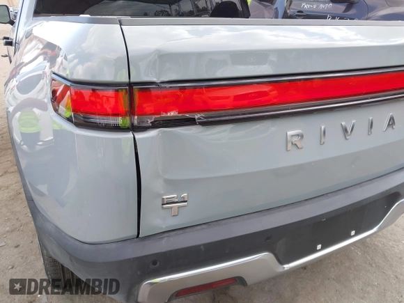 2023 Rivian R1T Adventure z VIN 7FCTGBAA9PN027894, wystawiony jako IAAI lot #42061339 z przebiegiem 5047 mil mil oraz . Historia ofert i sprzedaży dostępna na DreamBid. Obrazek 22.
