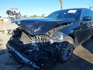 2019 BMW 5 Series 530e with VIN WBAJA9C57KB399541, listed as a IAAI auction lot 41656775 with 96,523 mi miles and . Bid and sale history available at DreamBid. Image 6.