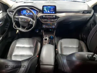 2020 Ford Escape Titanium z VIN 1FMCU9J98LUA93393, wystawiony jako Copart lot #65366925 z przebiegiem 74 750 mil mil oraz Czysty tytuł • Clean title. Historia ofert i sprzedaży dostępna na DreamBid. Obrazek 8.