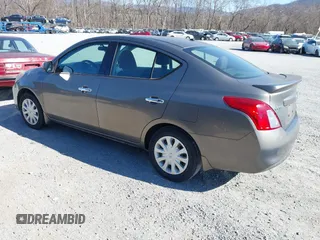 2014 Nissan Versa S with VIN 3N1CN7AP5EK451432, listed as a IAAI auction lot 41818916 with 126,190 mi miles. Bid and sale history available at carsss.com. Image 3.