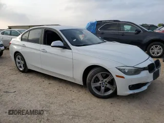 2014 BMW 3 Series 328i with VIN WBA3C1C52EK111563, listed as a Copart auction lot 51465165 with 142,125 mi miles and Salvage title. Bid and sale history available at DreamBid. Image 4.