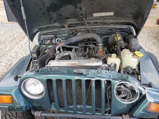 1999 Jeep Wrangler Sport with VIN 1J4FY19S0XP402688, listed as a Copart auction lot 58968125 with 211,910 mi miles and Salvage title. Bid and sale history available at DreamBid. Image 11.