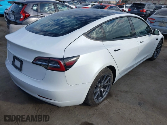 2022 Tesla Model 3 with VIN 5YJ3E1EA8NF210196, listed as a IAAI auction lot 41674407 with 24,270 mi miles. Bid and sale history available at carsss.com. Image 4.