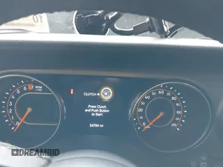 2021 Jeep Wrangler Unlimited Sport S z VIN 1C4HJXDG2MW542087, wystawiony jako IAAI lot #41893734 z przebiegiem 57 000 mil mil oraz . Historia ofert i sprzedaży dostępna na DreamBid. Obrazek 7.