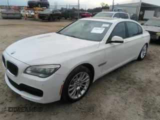 2015 BMW 7 Series 750Li with VIN WBAYE8C50FD781160, listed as a IAAI auction lot 41061232 with 154,496 mi miles. Bid and sale history available at carsss.com. Image 2.