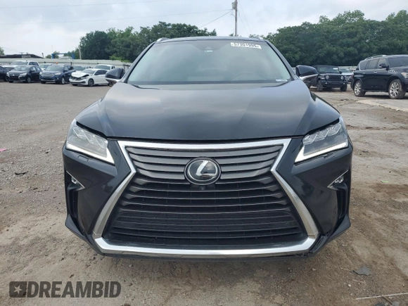 2017 Lexus RX 350 with VIN 2T2BZMCA9HC129460, listed as a Copart auction lot 57301995 with 163,128 mi miles and Salvage title. Bid and sale history available at DreamBid. Image 5.