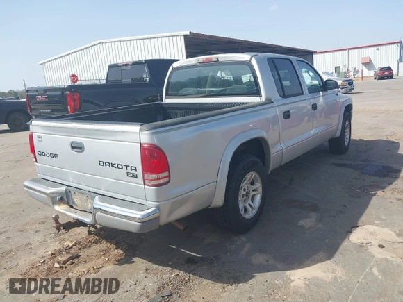 2003 Dodge Dakota SLT with VIN 1D7HL48N83S236590, listed as a IAAI auction lot 41796103 with 221,667 mi miles. Bid and sale history available at carsss.com. Image 4.
