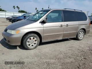 2004 Honda Odyssey EX-L with VIN 5FNRL18934B107378, listed as a Copart auction lot 51972795 with 186,043 mi miles and Salvage Title. Bid and sale history available at DreamBid. Image 1.