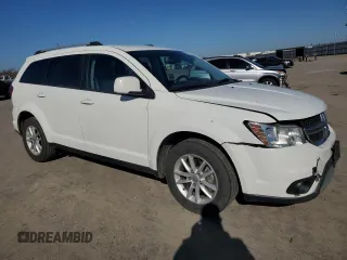 2017 Dodge Journey SXT with VIN 3C4PDCBB8HT675449, listed as a Copart auction lot 88999075 with 105,765 mi miles and Salvage Title. Bid and sale history available at DreamBid. Image 4.