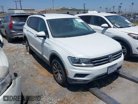 2018 Volkswagen Tiguan S with VIN 3VV1B7AX8JM032990, listed as a IAAI auction lot 42279807 with 74,185 mi miles and . Bid and sale history available at DreamBid. Image 1.