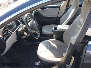 2013 Tesla Model S with VIN 5YJSA1CN7DFP26335, listed as a IAAI auction lot 41529752 with 247,789 mi miles. Bid and sale history available at carsss.com. Image 5.