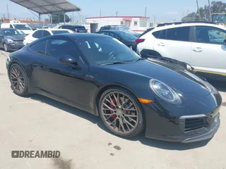2017 Porsche 911 Carrera S z VIN WP0AB2A92HS123063, wystawiony jako IAAI lot #42207005 z przebiegiem 80 270 mil mil oraz . Historia ofert i sprzedaży dostępna na DreamBid. Obrazek 1.