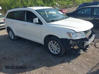 2017 Dodge Journey SXT z VIN 3C4PDCBG9HT589904, wystawiony jako IAAI lot #42084994 z przebiegiem 130 194 mil mil oraz . Historia ofert i sprzedaży dostępna na DreamBid. Obrazek 1.