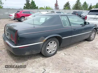 2002 Cadillac Eldorado ESC z VIN 1G6EL12Y82B105241, wystawiony jako IAAI lot #42241609 z przebiegiem 90 442 mil mil oraz . Historia ofert i sprzedaży dostępna na DreamBid. Obrazek 4.