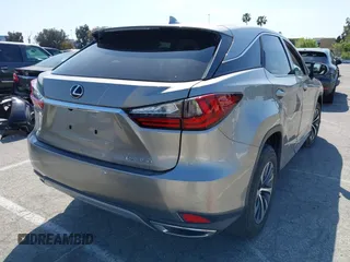 2022 Lexus RX with VIN 2T2AZMAAXNC228573, listed as a IAAI auction lot 41976051 with 22,784 mi miles. Bid and sale history available at carsss.com. Image 4.
