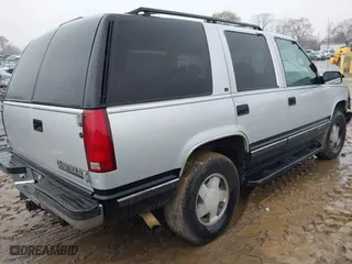 1997 Chevrolet Tahoe with VIN 1GNEK13R0VJ351919, listed as a IAAI auction lot 41028840 with 218,937 mi miles. Bid and sale history available at carsss.com. Image 4.