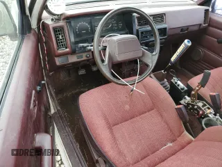 1990 Nissan Frontier with VIN 1N6SD16S9LC404281, listed as a Copart auction lot 84214904 with 279,270 mi miles and Salvage title. Bid and sale history available at DreamBid. Image 8.