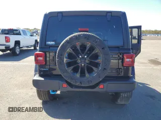 2023 Jeep Wrangler Sahara z VIN 1C4JJXP66PW605961, wystawiony jako Copart lot #50209655 z przebiegiem 32 805 mil mil oraz Szkoda całkowita • Salvage title. Historia ofert i sprzedaży dostępna na DreamBid. Obrazek 6.