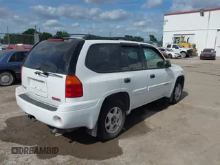 2003 GMC Envoy SLT with VIN 1GKDS13S732379218, listed as a IAAI auction lot 42164368 with Not Provided miles. Bid and sale history available at carsss.com. Image 4.