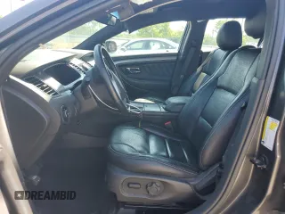 2015 Ford Taurus SEL z VIN 1FAHP2E83FG125234, wystawiony jako Copart lot #54404745 z przebiegiem 107 311 mil mil oraz Szkody całkowita. Historia ofert i sprzedaży dostępna na DreamBid. Obrazek 7.