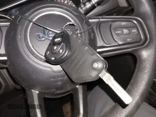 2022 Jeep Wrangler Unlimited Sport with VIN 1C4HJXDG0NW117632, listed as a IAAI auction lot 41185850 with 18,298 mi miles and . Bid and sale history available at DreamBid. Image 11.