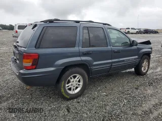 2004 Jeep Grand Cherokee Laredo with VIN 1J4GX48SX4C201569, listed as a Copart auction lot 58631585 with 271,124 mi miles and Salvage title. Bid and sale history available at DreamBid. Image 3.