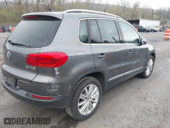 2013 Volkswagen Tiguan SE with VIN WVGAV7AX9DW547633, listed as a IAAI auction lot 42009704 with 51,826 mi miles and . Bid and sale history available at DreamBid. Image 4.