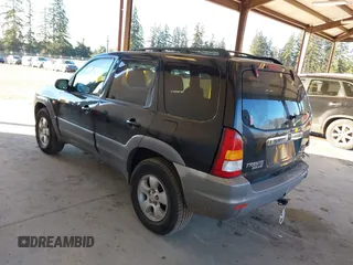 2002 Mazda Tribute LX with VIN 4F2CU08172KM58561, listed as a IAAI auction lot 41435407 with 141,908 mi miles and . Bid and sale history available at carsss.com. Image 3.