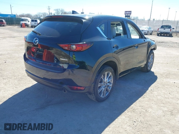 2020 Mazda CX-5 Grand Touring with VIN JM3KFBDMXL0763316, listed as a IAAI auction lot 41661958 with 64,881 mi miles and . Bid and sale history available at carsss.com. Image 4.